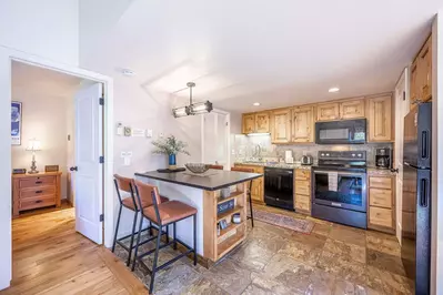Gorgeously updated 3 bedroom / 2 bathroom home at Red Pine in Canyons. The updated kitchen offers a brand new breakfast bar with 4 comfortable bar sto