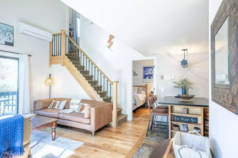 The condo is open concept and the living area is fully furnished with comfortable furnishings, fireplace, hardwood floors and HDTV with satellite TV.