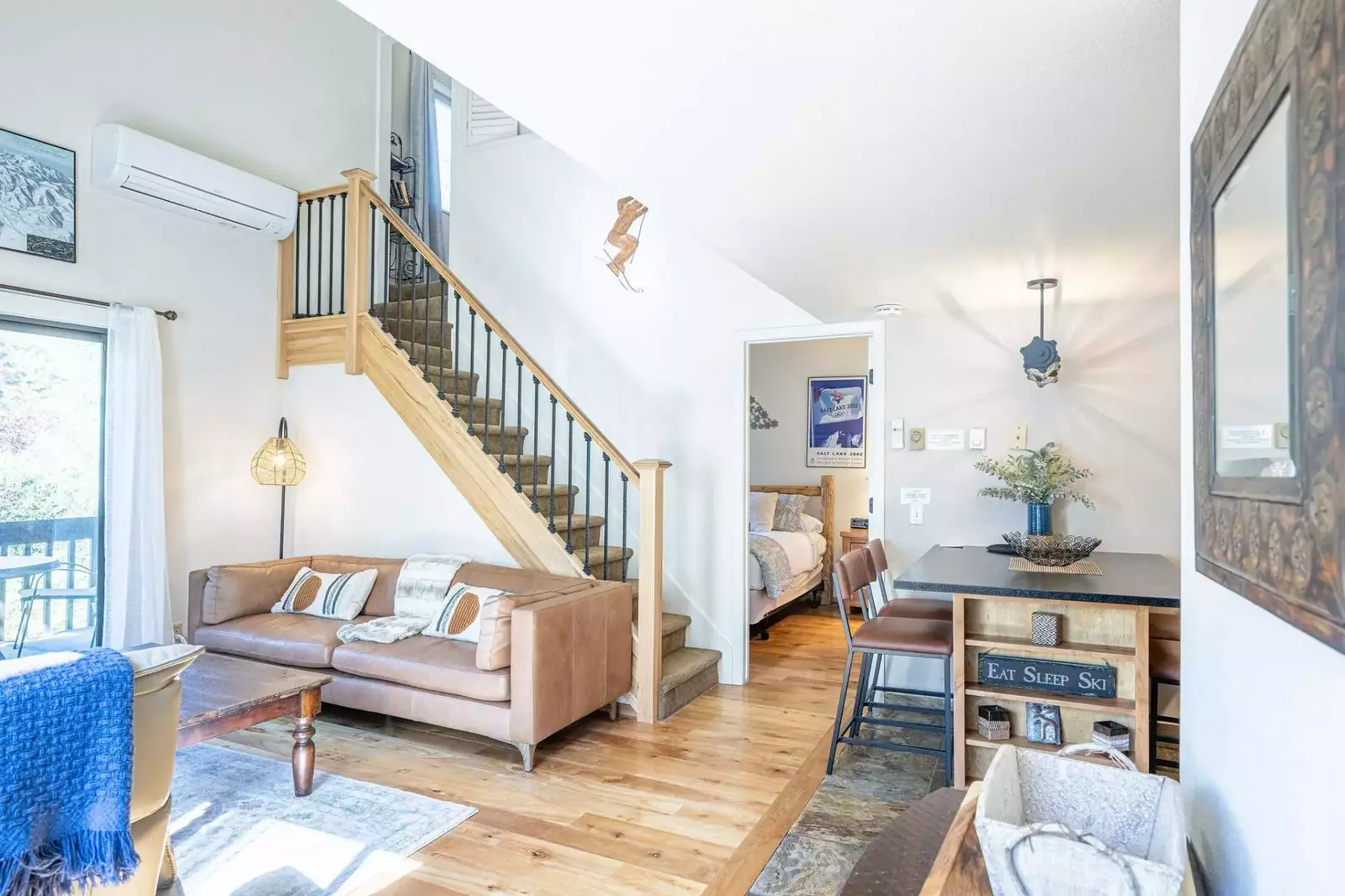 The condo is open concept and the living area is fully furnished with comfortable furnishings, fireplace, hardwood floors and HDTV with satellite TV.