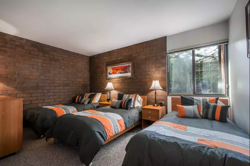 The third bedroom has three (3) twin beds, a large bedroom dresser and closet for all you storage needs.