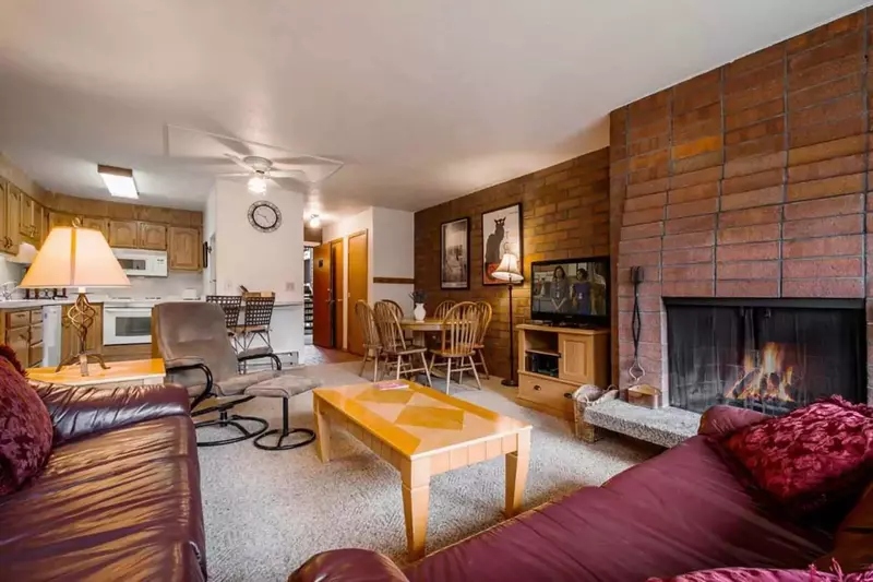 Perfect In Town Location! Cozy in By The Woodburning Fireplace & Enjoy Your Favorite Movie on the 50" HDTV