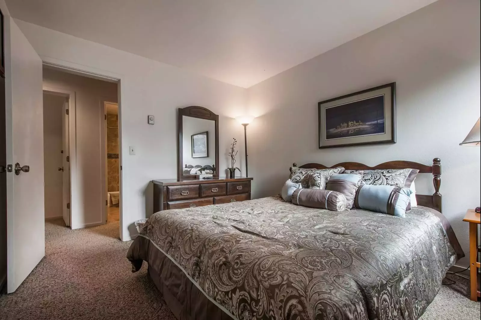 The second bedroom features a queen-size bed with comfortable linens and bedding, closet, large dresser and has lots of natural light.