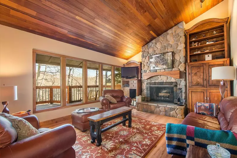 Private Deck, Natural lighting and panoramic views invite family and friends to gather in the living area.