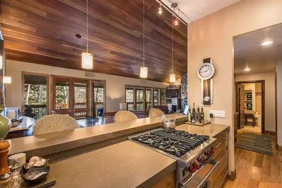 Let your inner chef out in this Fully Equipped Kitchen Complete with a High End Viking Gas Range, Wood Floor and Breakfast