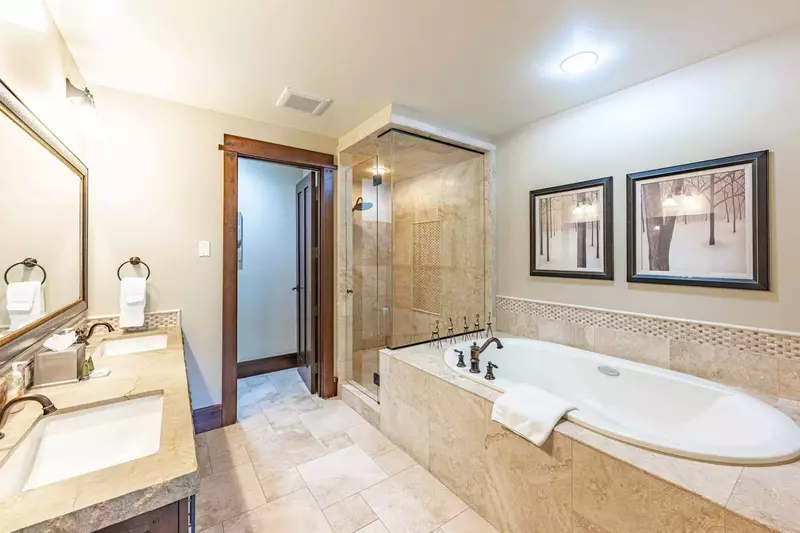 Primary En Suite Bathroom | Heated floors | Oversized Jetted Tub | Walk-In Glass Rainfall Shower