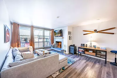 The Inviting Living Room is the perfect place to watch the big game - warm up some snacks and cozy in to watch on the  55" HDTV, Hardwood Floors, High