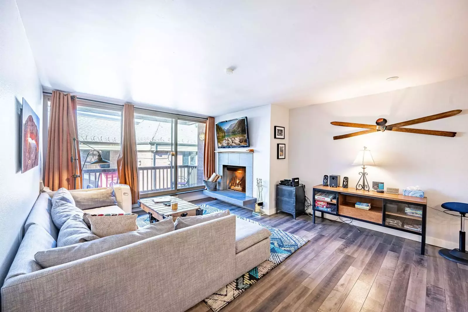 The Inviting Living Room is the perfect place to watch the big game - warm up some snacks and cozy in to watch on the  55" HDTV, Hardwood Floors, High