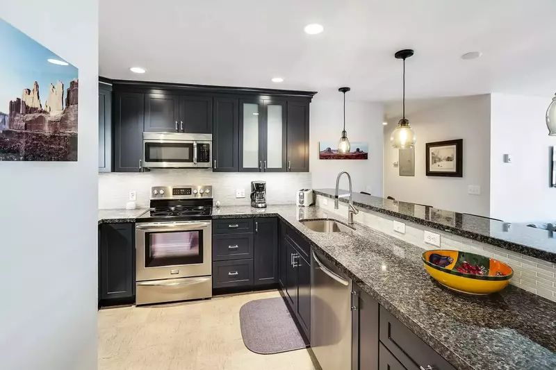 Fully Renovated Kitchen w Granite Countertops, High End Stainless Steel Appliances, All New Wood Cabinetry, Open Floor Plan, Subway Tiling, Wood Floor