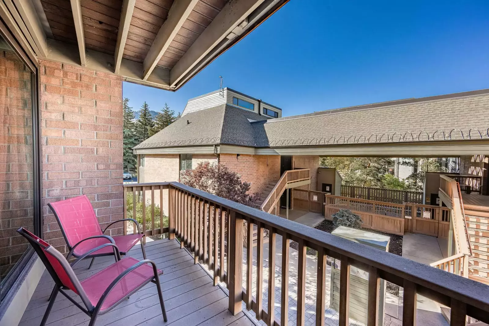 The first of two patios is located adjacent the living room and can be accessed by the sliding glass doors. The patio overlooks the courtyard and is p