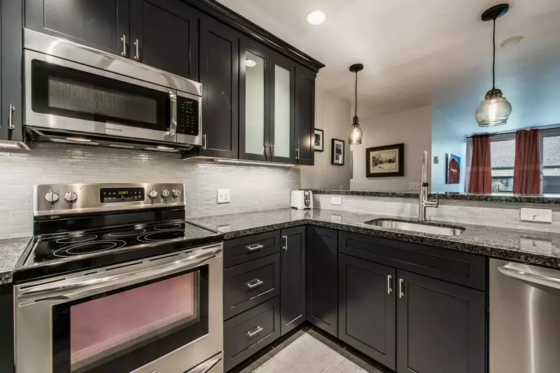 Like the rest of the home, the kitchen has been fully renovated with new cabinetry, flooring, countertops and appliances to create the chef’s kitchen.