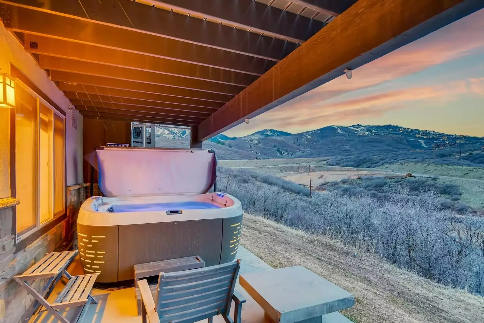 Located on the lower level is the private hot tub with spectacular views of the lake and mountains