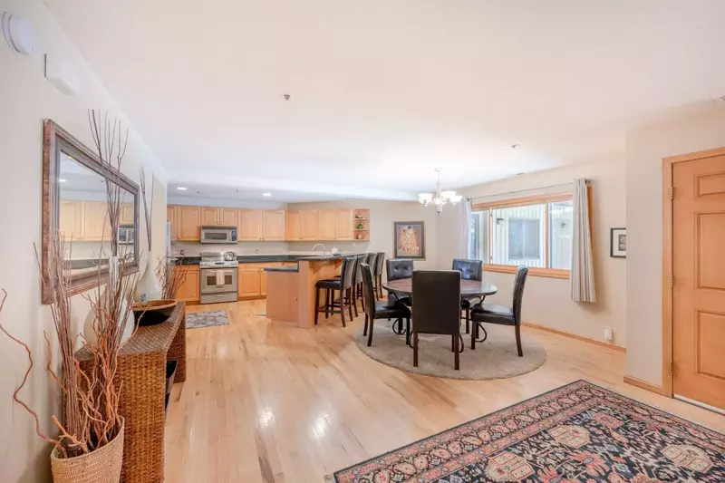 The open concept floor plan has hardwood flooring throughout, each room flowing seamlessly from one to the other. There is ample natural light