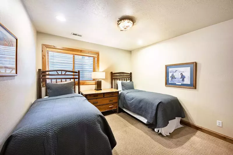 Located on the first level, this bedroom features 2 twin beds and is great for kids or groups.