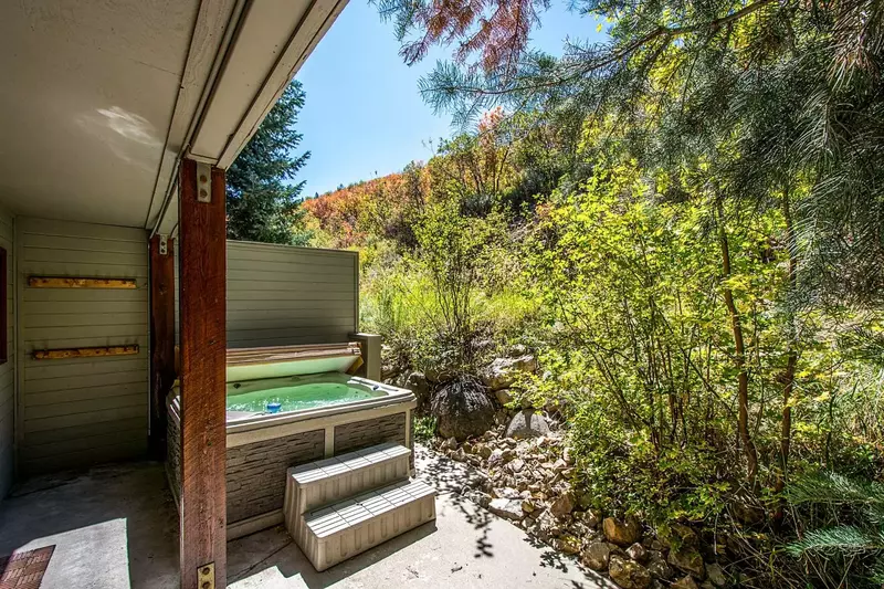 Nestled into the mountain is your private and secluded Jacuzzi hot tub with seating for six (6) people.