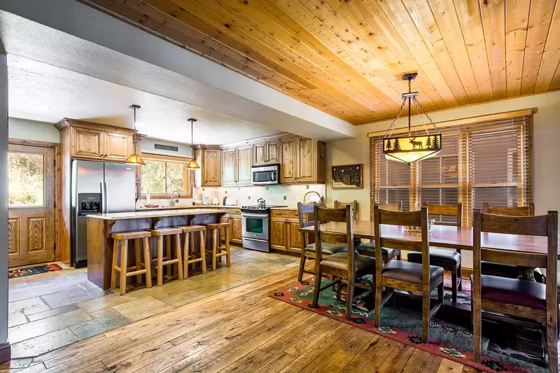 Luxury kitchen w breakfast bar for 4, granite countertops, stainless steel appliances, hardwood flooring, formal dining for 10