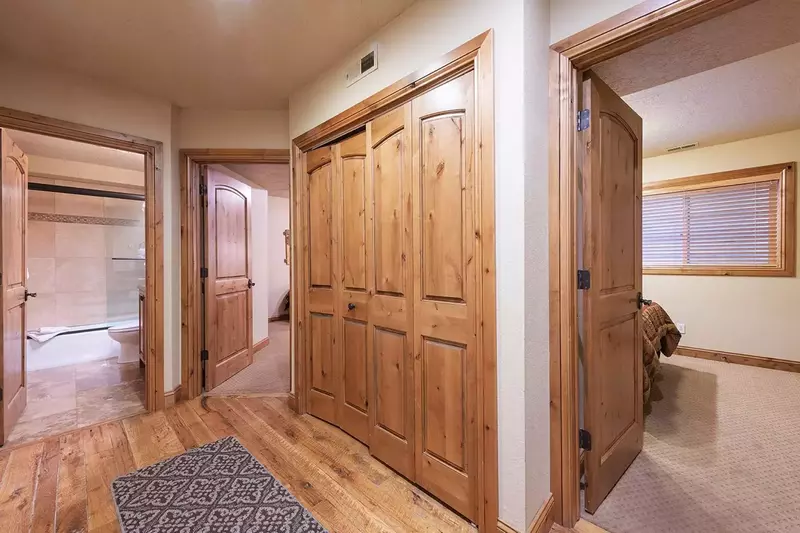 Welcome to 1177 Lowell Ave,  This is the Lower Level with Stunning wooded hallway with access to 2 bedrooms and an updated shared bathroom