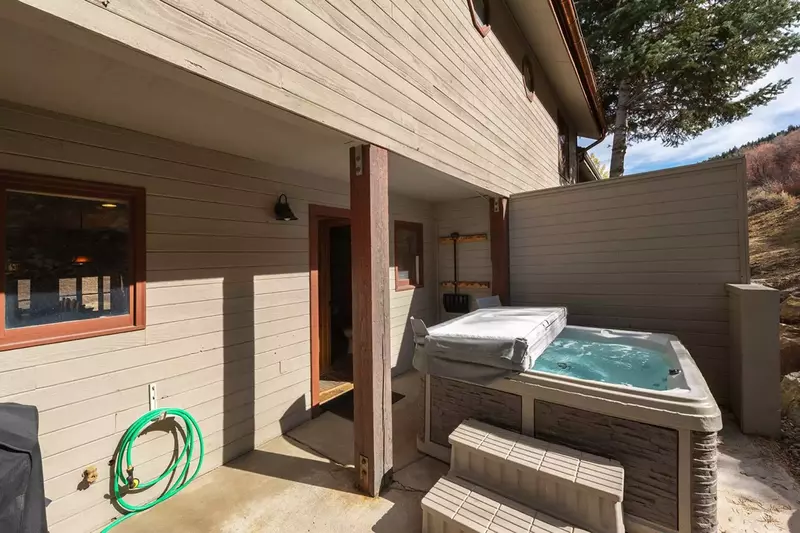 covered hot tub to keep temperatures ready to welcome and sooth.