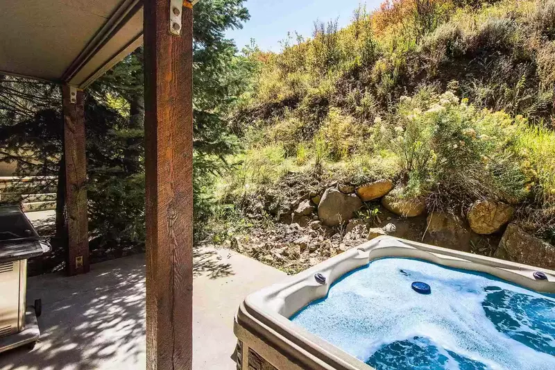 The second floor private deck has a gas grill and offers access to your private and secluded Jacuzzi hot tub with seating for six (6) people.