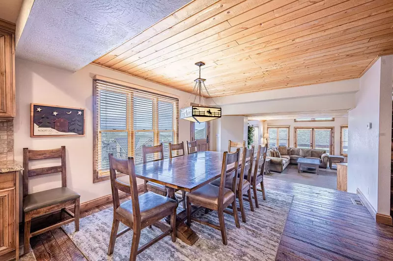 Living, dining and kitchen areas are centrally located on the middle floor with bedrooms above and beneath.