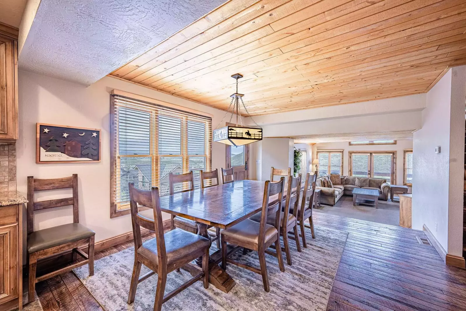 Living, dining and kitchen areas are centrally located on the middle floor with bedrooms above and beneath.