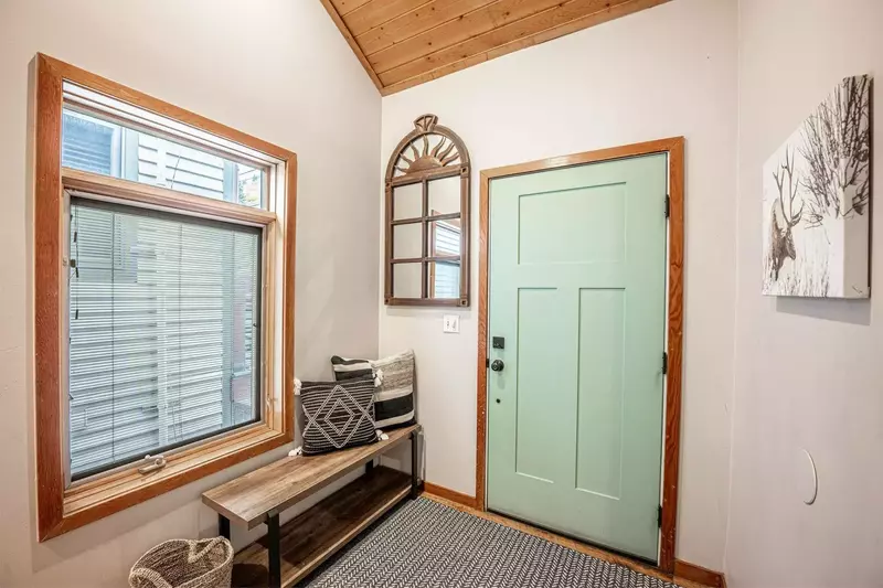 1st Floor Entry with a comfortable bench near the garage and front door, perfect for easily removing your shoes.