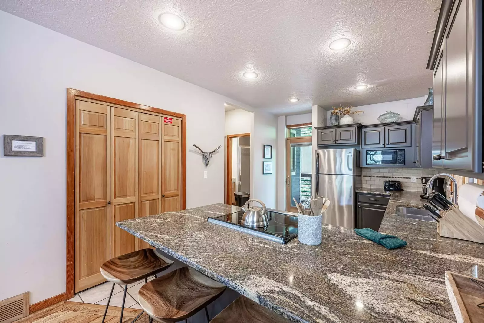 The cozy breakfast bar is the perfect spot for a quick bite or leisurely hangout.