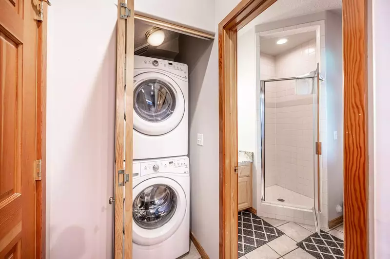 The private HE washer and dryer are conveniently located on the main level just off the kitchen.