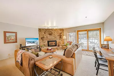 The living room of the home features a multiple places to relax and unwind with the cozy gas fireplace