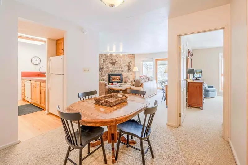 Adjacent to the Kitchen is the Dining Area w a Table Has Comfortable Seating for 4, Additional Seating at Breakfast Bar