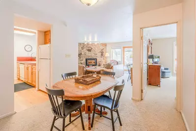 Adjacent to the Kitchen is the Dining Area w a Table Has Comfortable Seating for 4, Additional Seating at Breakfast Bar