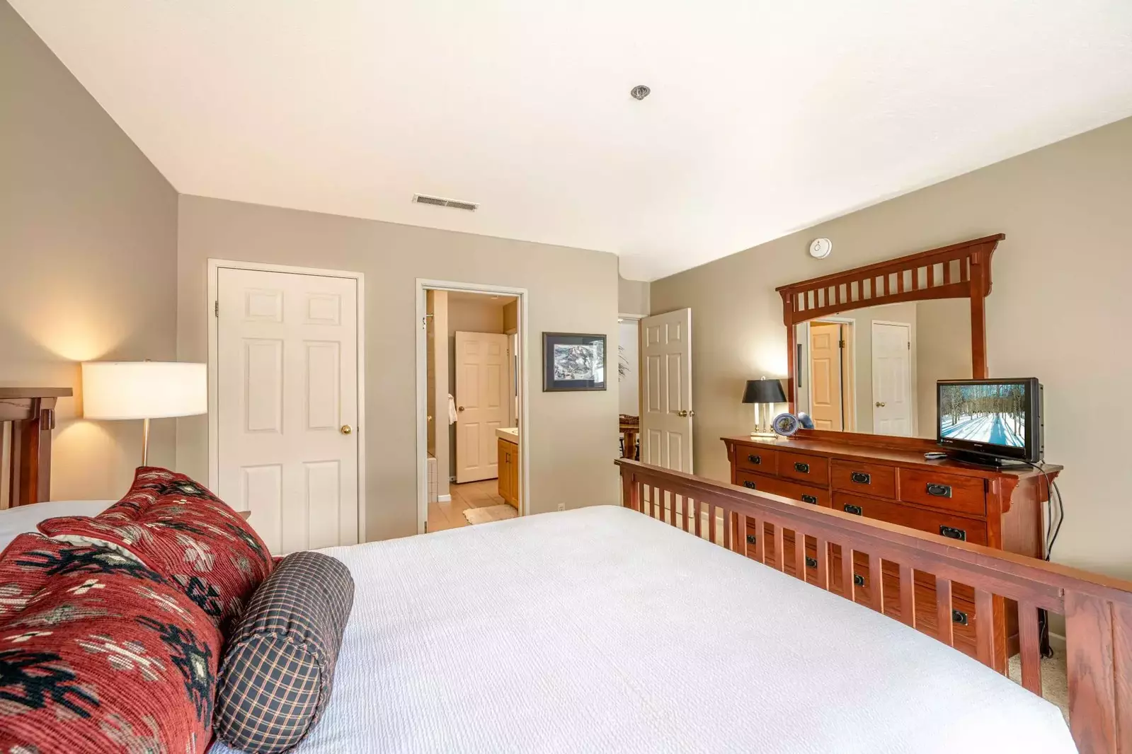 Secondary Suite is warmly decorated hardwood mission style furnishings, Top of the Line Pillowtop Queen Mattress,