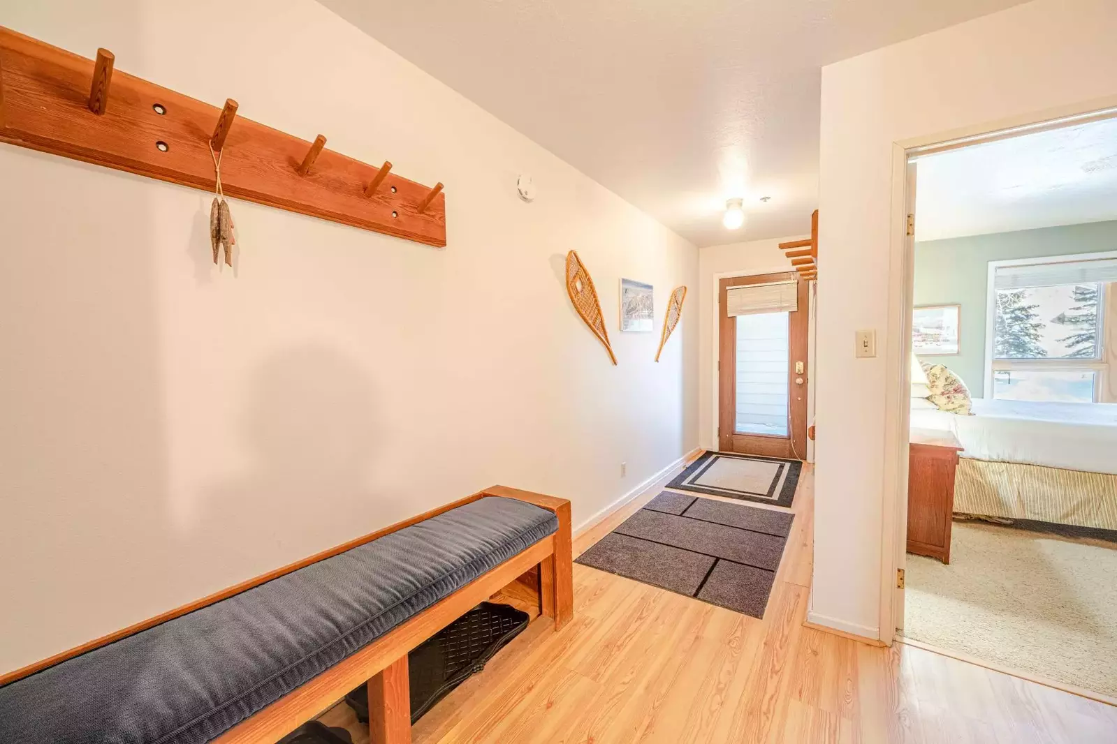 The entryway of the home provides storage for all your gear and a comfy bench to sit on after a long day