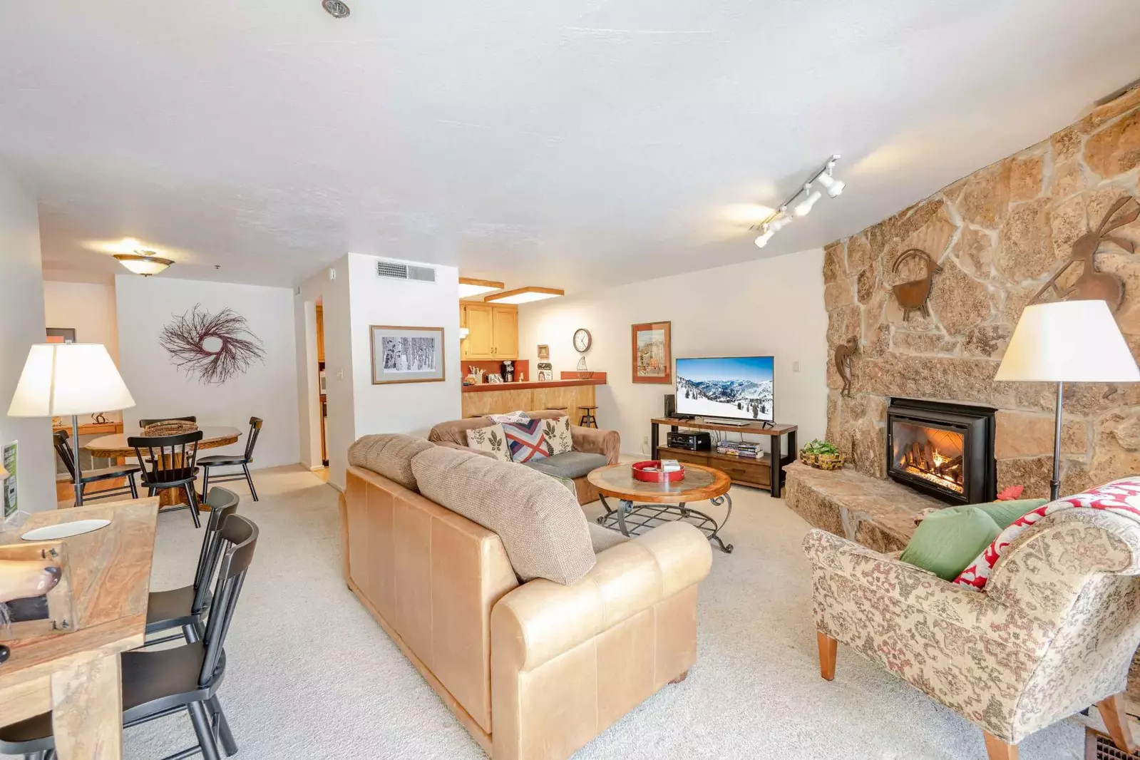 Open concept living area features comfortable furnishings, HDTV w Roku, DVD & Cable; Gas Fireplace Access to your private Deck & Hot tub