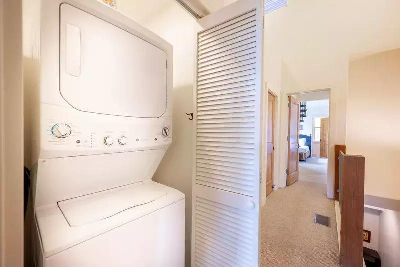 Located upstairs is the stackable washer and dryer