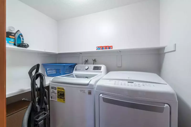 Laundry Room with New HE Washer and Dryer