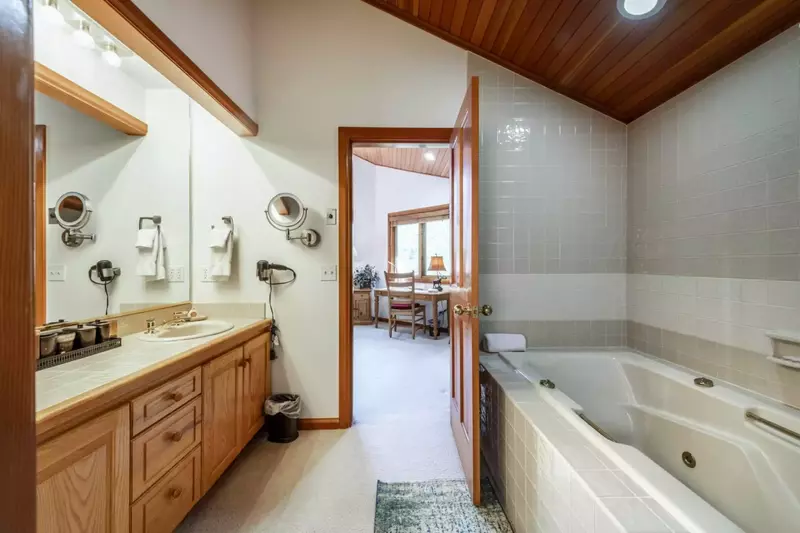 Master Bedroom En Suite Bathroom with Twin Vanities, Oversized Jetted Tub, Separate  Toilet and Glass Shower