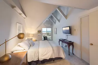 Main Floor Guest Suite Has a Comfortable Queen Bed, HDTV, En Suite Bath and a Futon That Is Perfect for Kids!