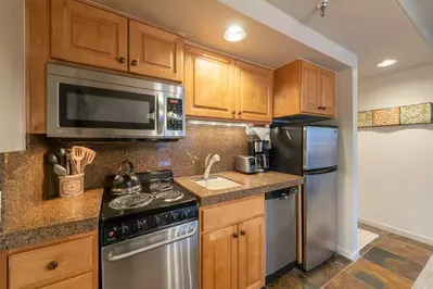 Our Updated Kitchen Has Everything To Cook At Home - New Stainless Steel Appliances, Granite Counter Top and Tiled Flooring