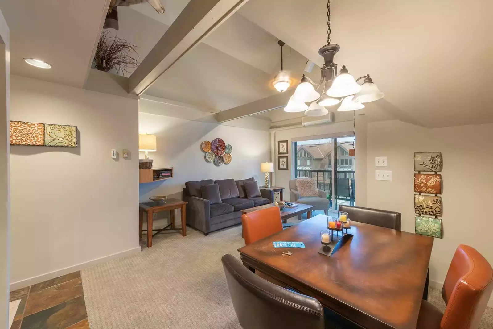 Bright and spacious living area includes vaulted ceilings and a Sofa Bed - Queen Sized