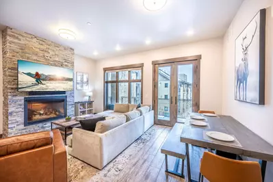 The spacious living room boasts beautiful double doors that open to your private balcony and a dining room table.