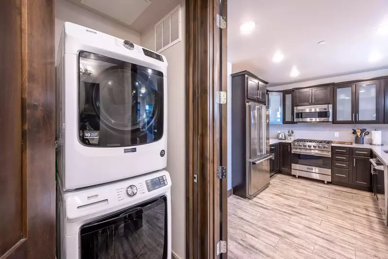 Just off the kitchen the home features a full sized washer and dryer for guest use