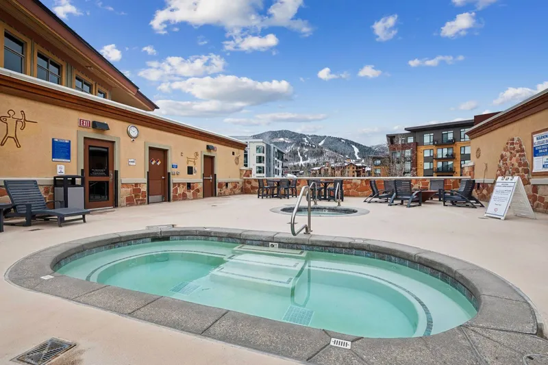 Community roof-top hot tub at Sundial Lodge with mountain views, perfect for unwinding after skiing at Park City Mountain.