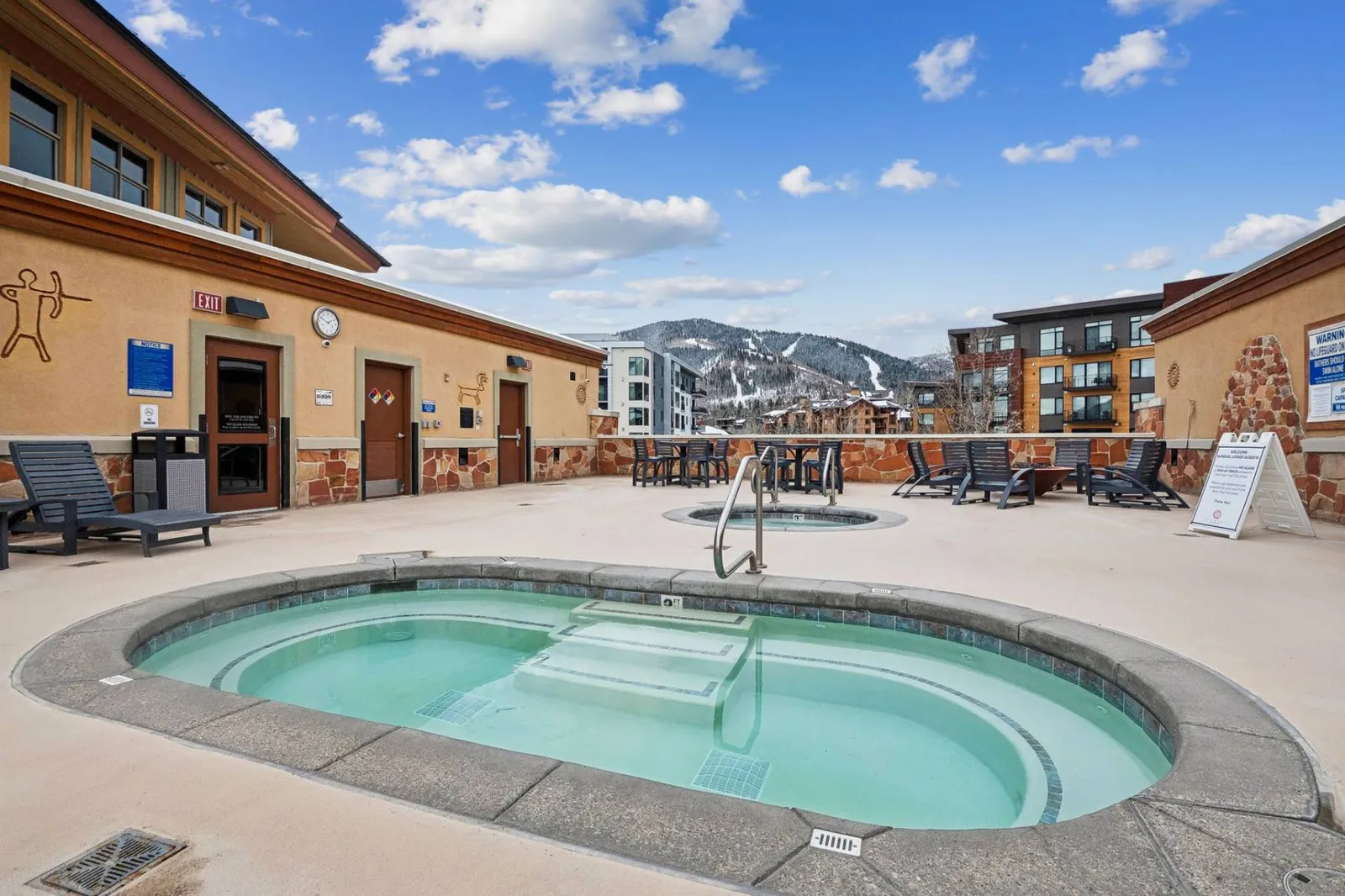 Community roof-top hot tub at Sundial Lodge with mountain views, perfect for unwinding after skiing at Park City Mountain.