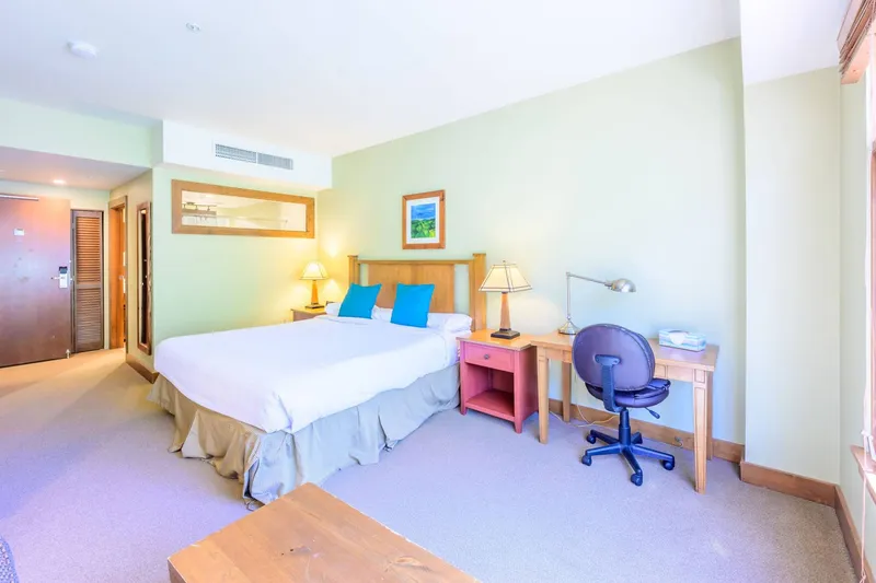 Primary suite with king bed and dedicated workspace, ideal for remote work during your Park City stay.