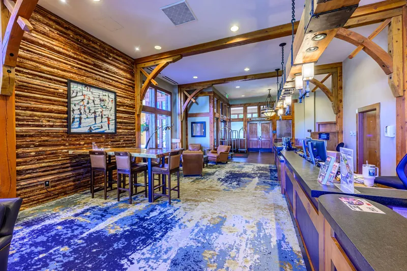 Sundial Lodge lobby with ski-in/ski-out access, front desk services, and warm mountain-lodge gathering space at Canyons Village.