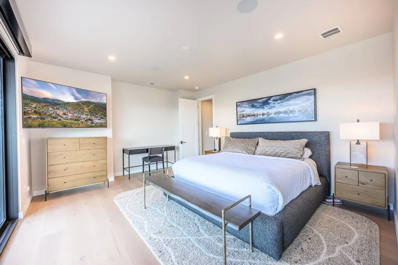 Primary bedroom with deck access and mountain views near Jordanelle Reservoir