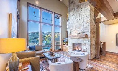 Luxury Park City vacation rental interior with fireplace, vaulted ceilings, and modern design