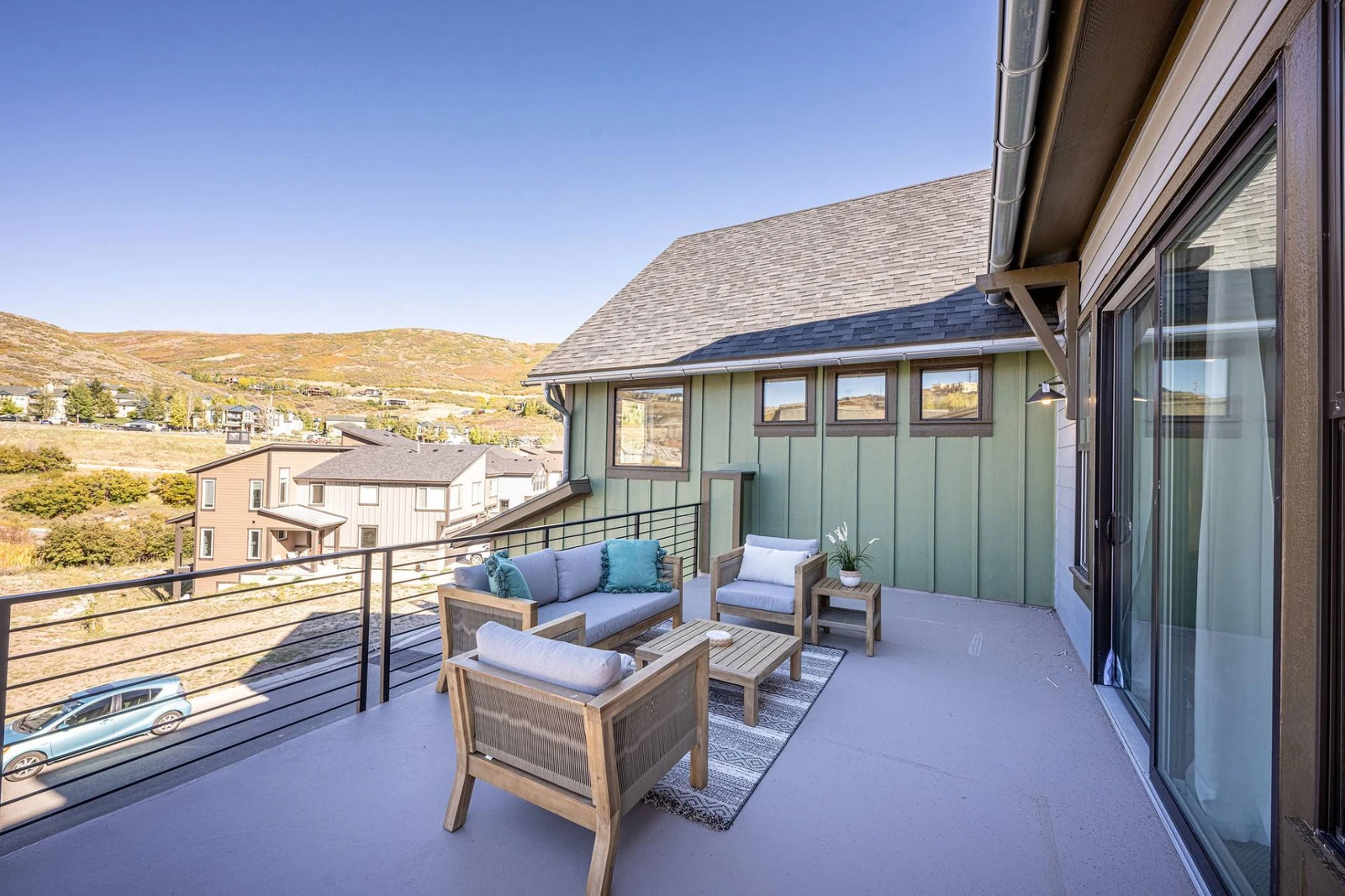 The home features a large private patio off the primary bedroom. (Please note the outdoor furniture may not be available during the winter)