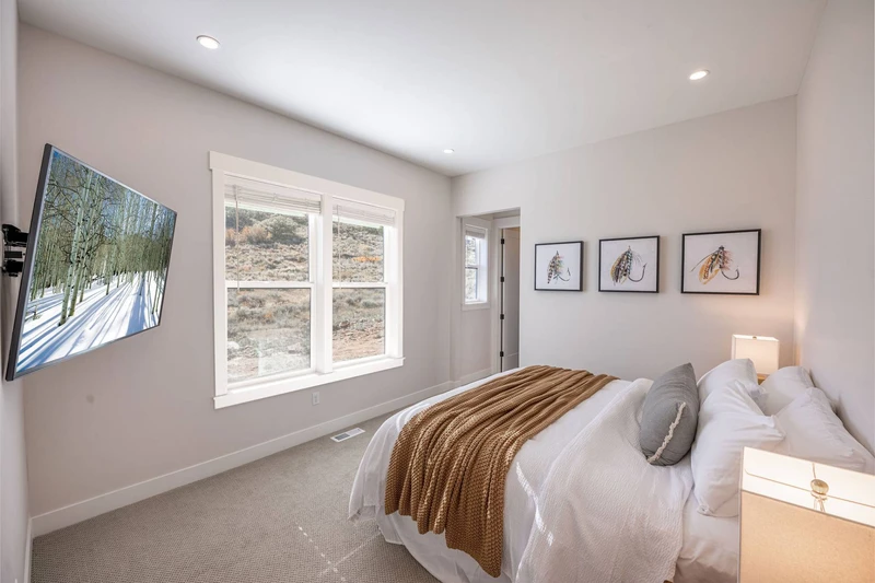 This king suite is just off the kitchen of the home and offers a private en suite bathroom and walk in closet