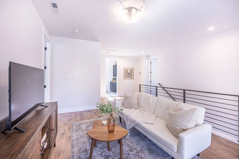 This spacious living room upstairs will be your perfect getaway during your vacation with an additional smart tv